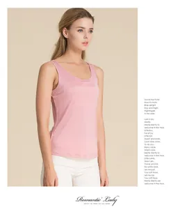 Close-up of pink silk tank top showing the smooth knit texture and elegant slim fit