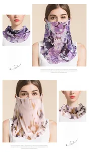 Detail of silk mesh neck gaiter with floral patterns and ruffled edges for sun protection