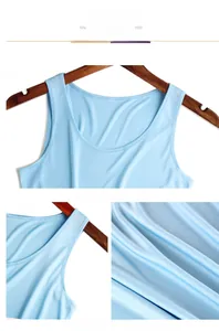 Detail view of light blue silk tank top showing round neckline and smooth fabric texture