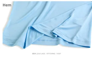 Detailed view of the sky blue silk vest hemline featuring neat stitching and seamless finish