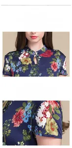 Detail of vintage mandarin collar with traditional button and floral silk fabric