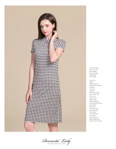 Detail of mandarin collar and button frog closure on houndstooth silk cheongsam dress