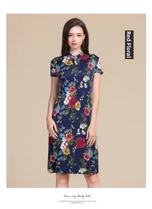 Detail of Chinese qipao dress with red floral print and traditional mandarin collar