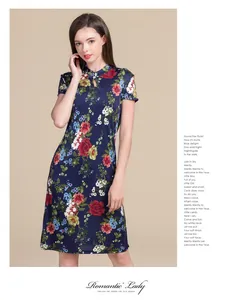 Detail of mandarin collar and teardrop cutout on blue floral silk cheongsam dress