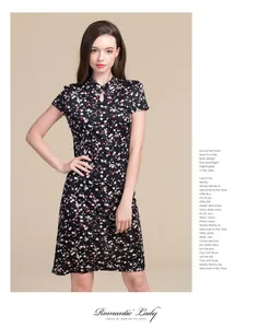 Detail of floral silk qipao dress with Mandarin collar and short sleeves in black