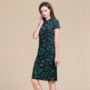 Short-sleeve silk cheongsam dress in black with green floral print and slim fit cut