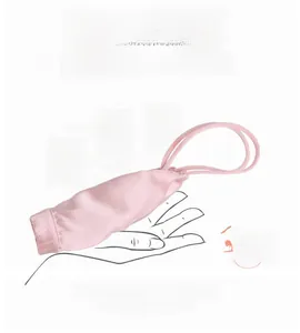 Detail showing the ultra-soft, flexible pink silk bra being twisted 360 degrees