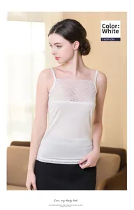 Detail of white silk camisole featuring delicate lace trim and soft knitted texture