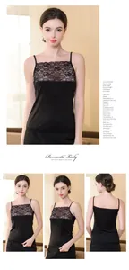 Detail of black silk camisole featuring delicate floral lace trim and adjustable straps