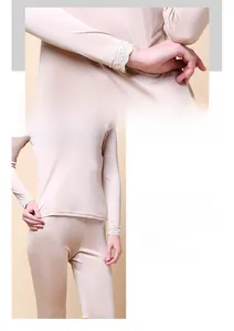 Detail of silk thermal underwear with delicate lace cuffs and elastic waistband