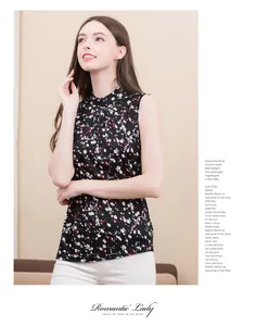 Detailed side view of floral silk knit tank top with high collar on female model