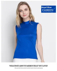 Close-up of royal blue silk knit top with mock neck and premium smooth fabric texture