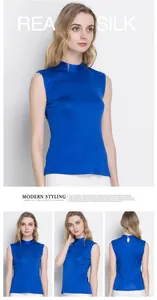Detailed view of royal blue sleeveless silk top featuring a high neck and teardrop back cutout