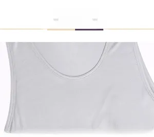 Detail of silver silk vest showing premium smooth texture and double-stitched neckline