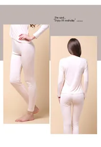 Detail view of lace cuffs on a pink silk thermal underwear set for women