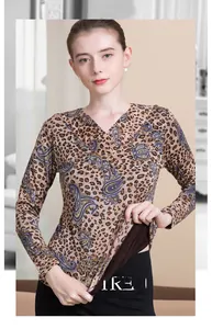 Close-up of V-neck wool sweater featuring leopard and blue paisley printed patterns