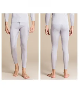 Men's silk knit thermal pants in light grey, featuring slim fit and breathable base layer