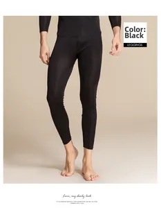 Close-up of black men's silk knit leggings showing the slim fit and elastic fabric