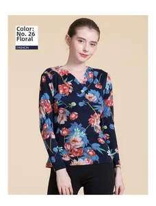 Detail of Pattern 26 blue wool knit sweater featuring vibrant floral print and V-neckline