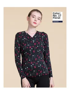 Detail of V-neck wool sweater featuring pink floral pattern No. 27 on charcoal base