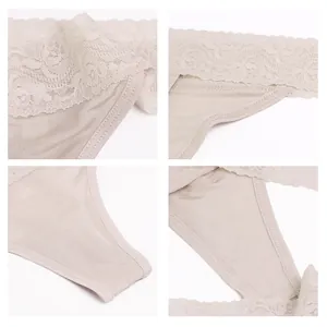 Silk thong with low waist lace trim in champagne color featuring seamless stitching