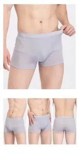 Detail view of light grey silk boxer briefs with elastic waistband and soft texture