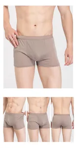 Detail view of coffee brown silk boxer briefs showing elastic fabric and breathable fit