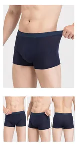 Detailed four-way view of deep blue silk boxer briefs with elastic waistband