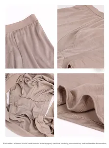 Detail view of khaki silk boxers with elastic waistband and reinforced stitching