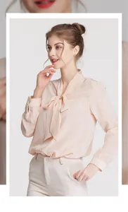 Detail of elegant silk pussy bow neckline on a long sleeve apricot office shirt