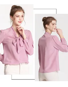 Detail view of pink silk shirt featuring elegant neck bow tie and smooth drape fabric