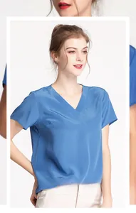 Detail of the elegant V-neckline and high-quality silk texture on this blue short sleeve top