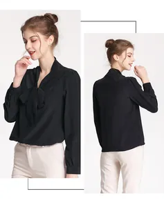 Detail of elegant black silk pussy-bow blouse with long sleeves and front tie design