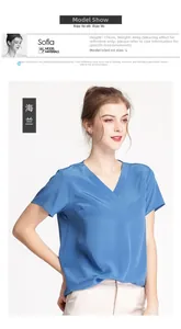 Short sleeve V-neck silk top in navy blue silk crepe shown on a professional model