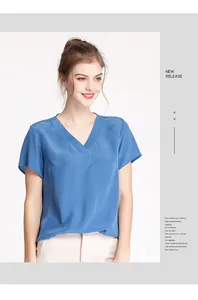 Detailed view of the V-neckline and smooth silk texture on a blue summer blouse