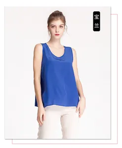 Detail of royal blue silk tank top showing smooth texture and loose sleeveless design
