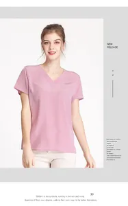 Detail of elegant V-neck pink silk blouse showing premium texture and drape on a model