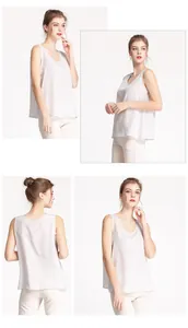 Macro detail of the smooth silk crepe texture and drape on this light gray camisole top