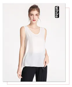Detail of white silk crepe tank top showing the round neckline and airy fabric texture