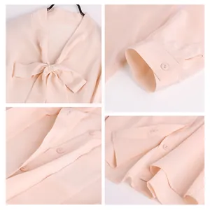 Pink silk long-sleeved women's blouse featuring a bow-tie neck and polished button details