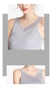 Detail of elegant grey silk tank top showing intricate lace V-neckline and smooth texture