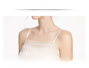 Detail of silk camisole top featuring delicate lace trim and smooth satin texture