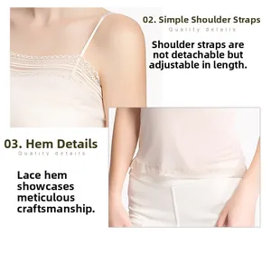 Detail of adjustable thin shoulder straps and delicate lace trim on silk camisole