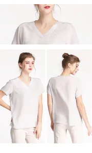 Detail view of V-neck silk blouse showing premium satin texture and relaxed summer fit