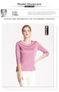 Detail of elegant red-bean silk knit blouse featuring smooth texture and round neckline