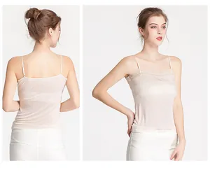 Detail view of lace trim and adjustable straps on silk camisole top for women