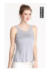 Detail of silver grey silk camisole with delicate V-neck lace trim and satin texture
