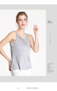 Close-up of silk camisole featuring delicate lace trim and elegant V-neckline design