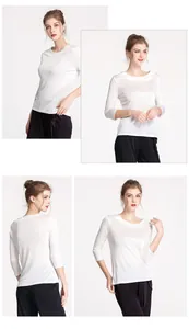 Front and back views of a white silk three-quarter sleeve top for women with a slim fit