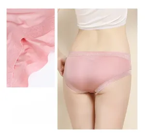 Detailed view of seamless mulberry silk panties with floral lace edges and smooth texture